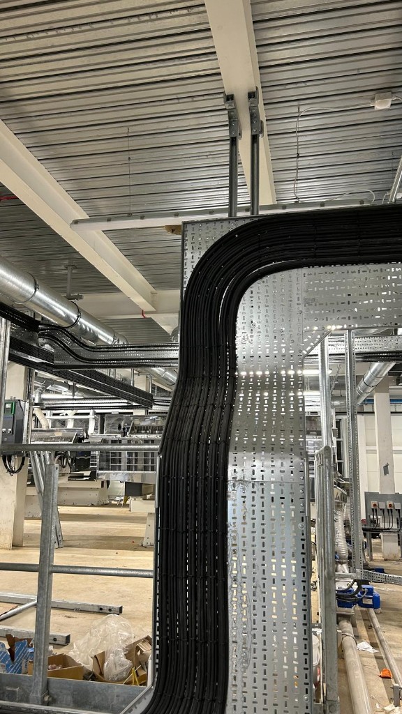 Neat cable tray installation with curved bend inside the mill