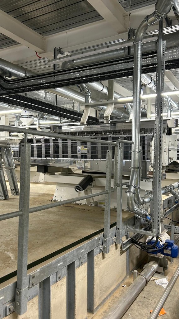Galvanised steelwork and pipework inside the completed mill building