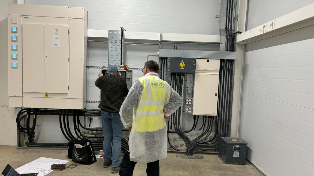 NEC Ltd engineers commissioning switchgear panels inside the mill